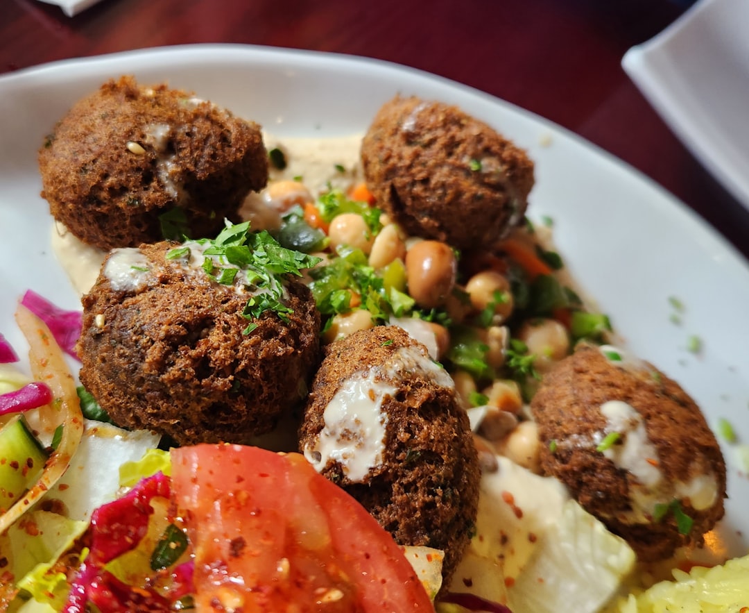 Family feast platter with gyros souvlaki Greek salad pita and dips