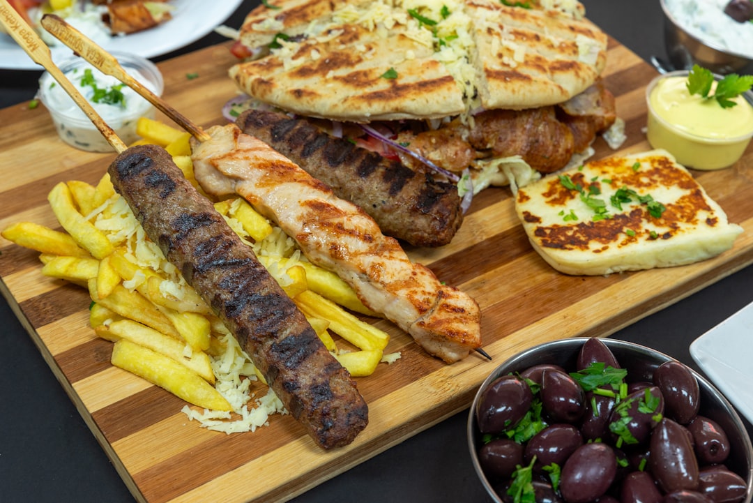 Lamb souvlaki skewers with herbs and roasted vegetables